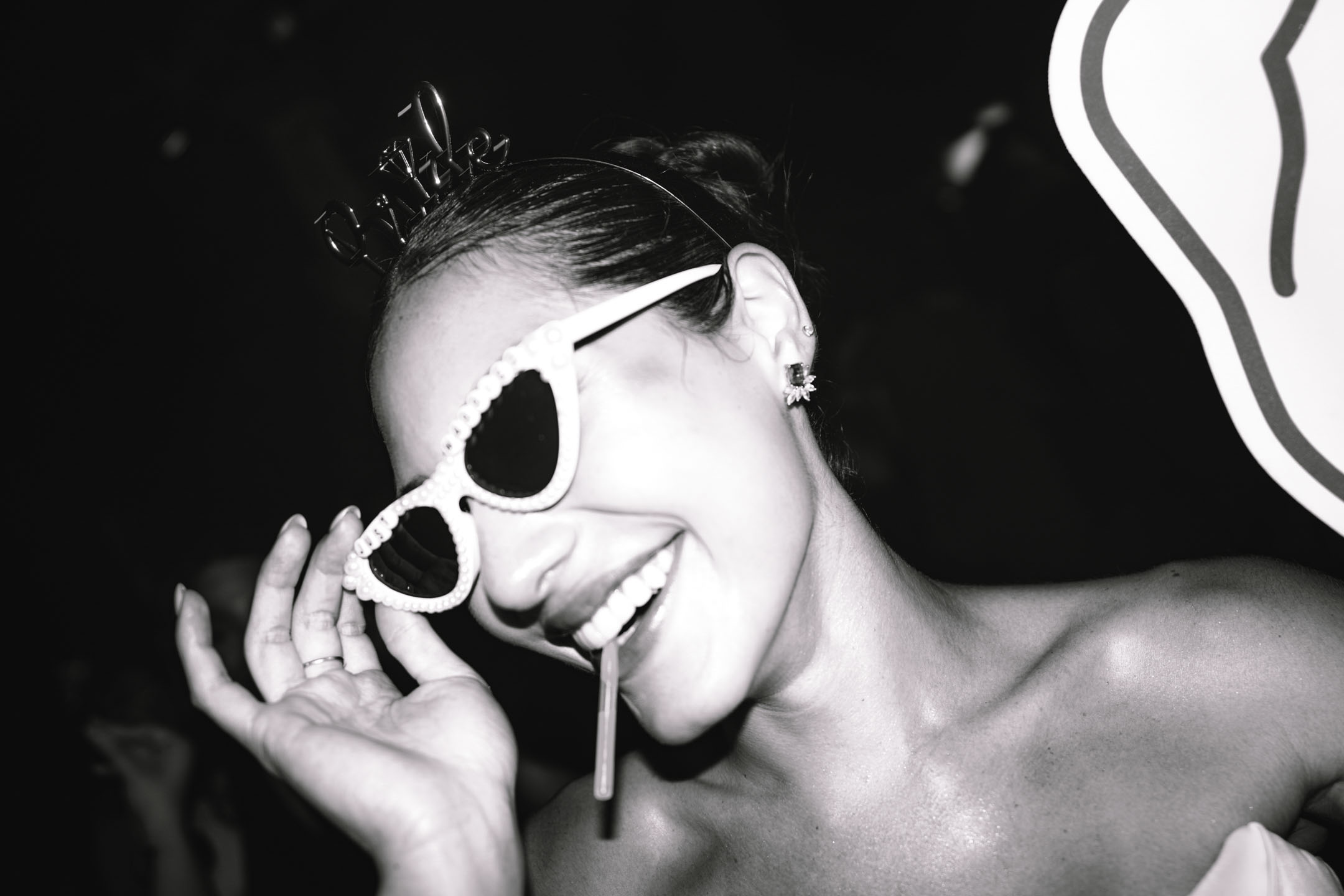Black and white candid of the bride celebrating